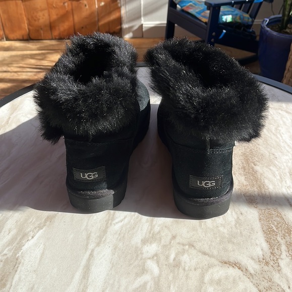 Ugg bootie. Black fluffy top with silver pin. Excellent condition. - Picture 4 of 6